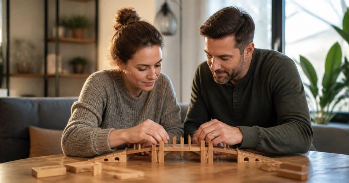 Adult couple building a bridge-shaped puzzle together at a table